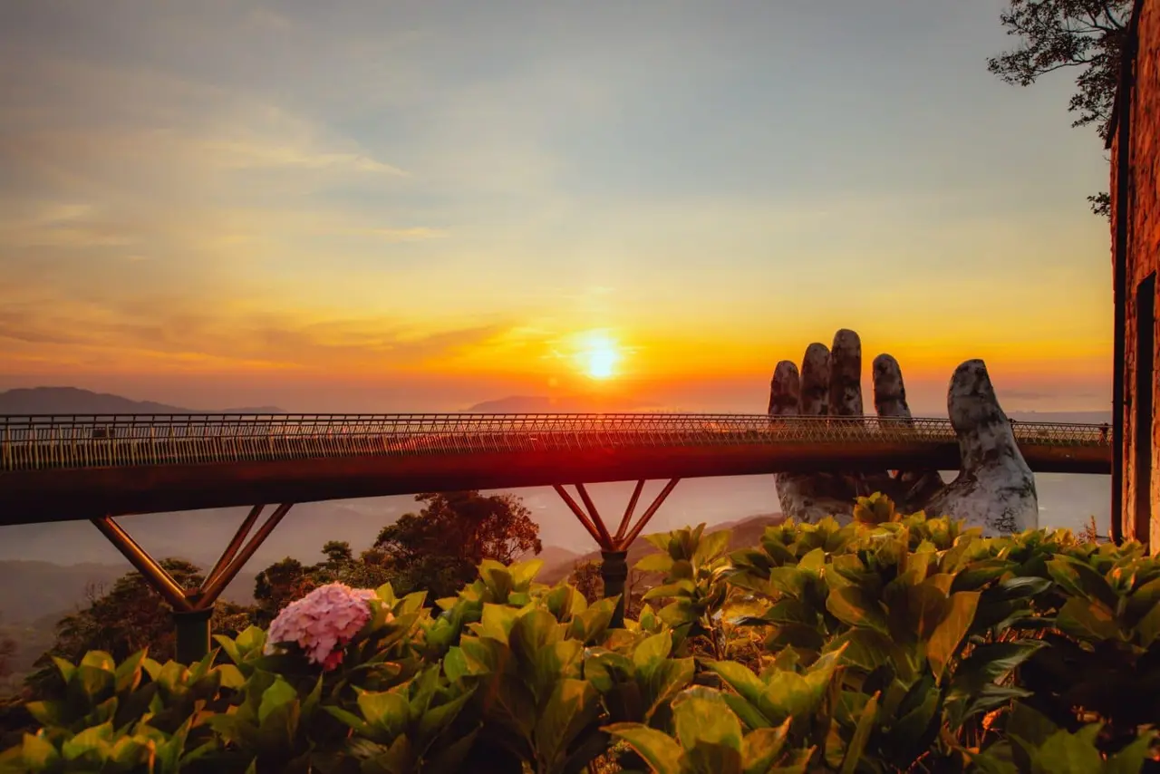 Ba Na Hills 2026: The Ultimate A-Z Travel Guide for a Perfect Trip 19 Ba Na Hills Golden Bridge at sunset with warm golden light and misty mountains