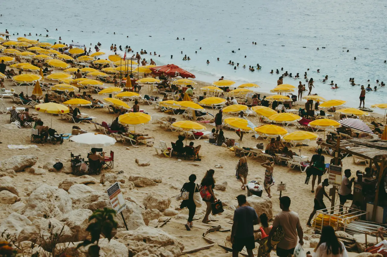 Da Nang Travel Guide 2026: 15 Best Things to Do, Itineraries & Insider Tips for Vietnam's Coastal Gem 5 Da Nang beach lifestyle with colorful umbrellas and people enjoying sunbathing on sandy beach