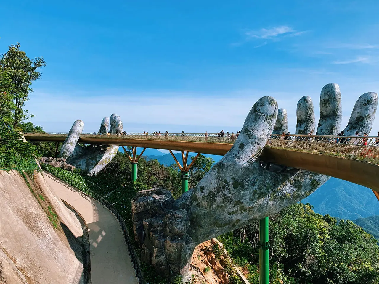Ba Na Hills 2026: The Ultimate A-Z Travel Guide for a Perfect Trip 6 Close-up view of Golden Bridge stone hands detail with golden walkway