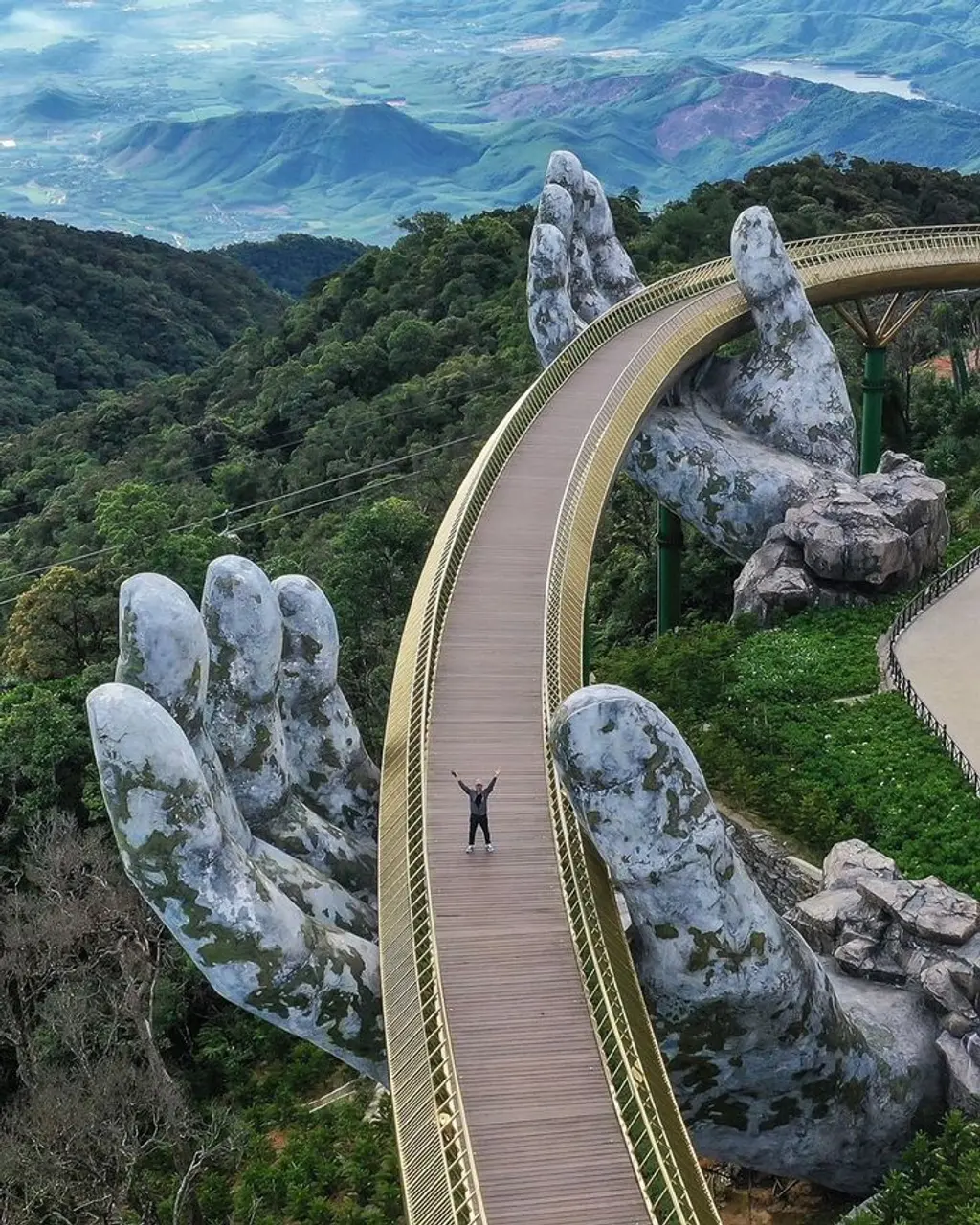 Ba Na Hills 2026: The Ultimate A-Z Travel Guide for a Perfect Trip 16 Golden Bridge photographed from Thien Thai Garden showing full span and hands