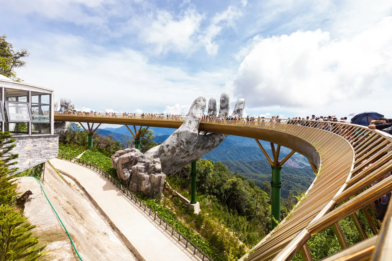 Ba Na Hills 2026: The Ultimate A-Z Travel Guide for a Perfect Trip 3 Golden Bridge Ba Na Hills with giant stone hands holding the bridge above clouds